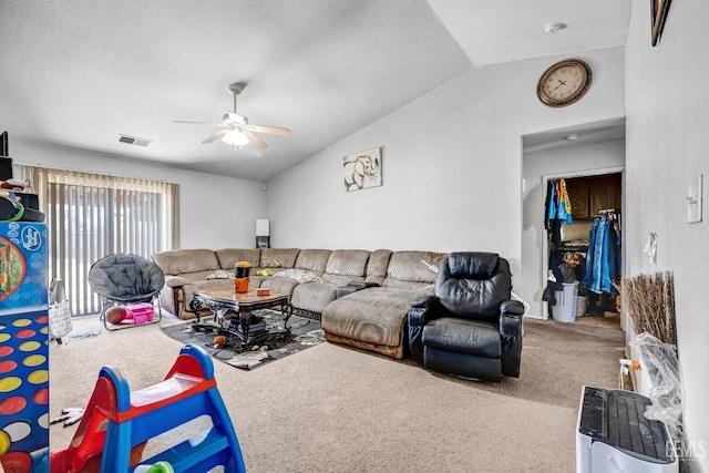 living room with ceiling fan, carpet, and vaulted ceiling