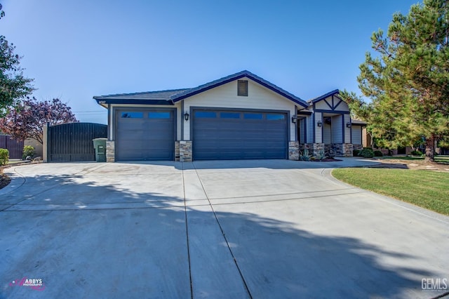 view of front of house featuring a front yard and a garage