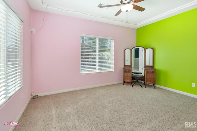 unfurnished bedroom featuring ceiling fan and carpet