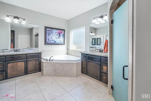 bathroom with vanity, tile patterned floors, and separate shower and tub