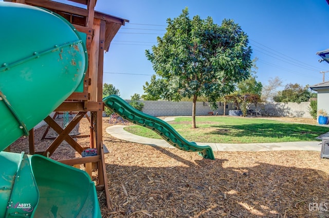 view of jungle gym featuring a yard