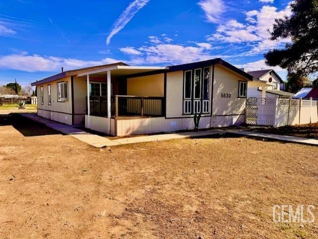 back of property with fence