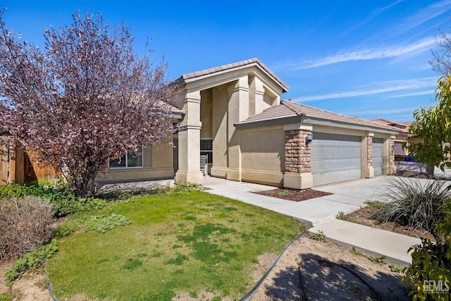 view of front of property featuring a garage, driveway, a tile roof, a front lawn, and stucco siding