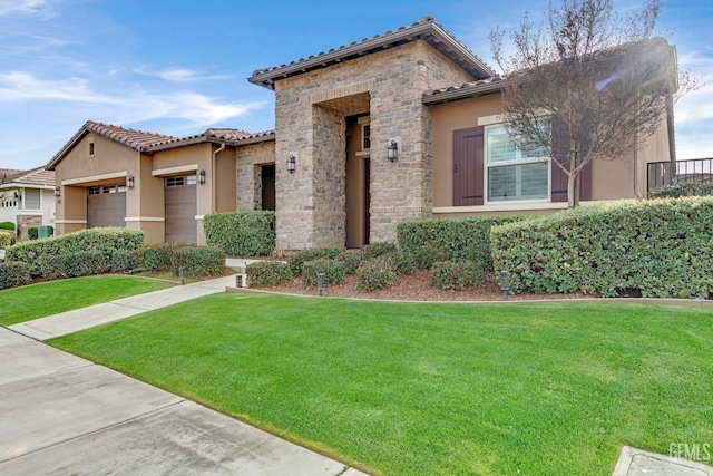 mediterranean / spanish home with a front lawn