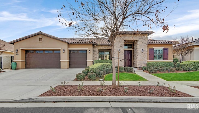 mediterranean / spanish-style house with a garage