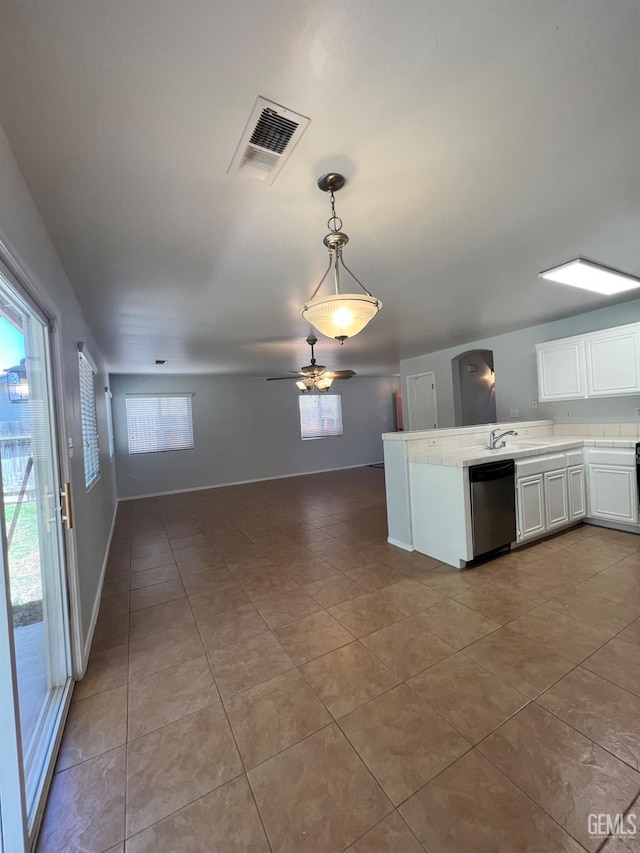 9809 Battersea Park Dr, Bakersfield, CA 93312 - kitchen featuring dishwasher, a sink, open floor plan, white cabinets, and light tile patterned floors