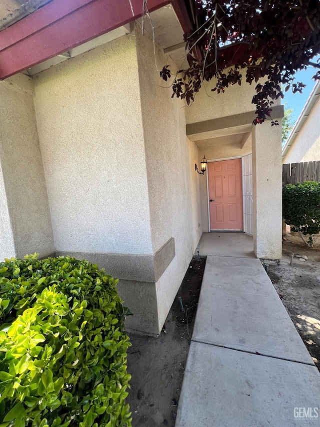 9809 Battersea Park Dr, Bakersfield, CA 93312 - property entrance with stucco siding