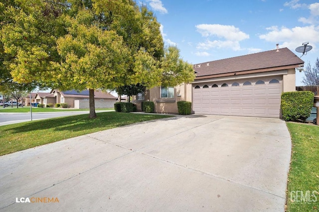 view of front of home with stucco siding, driveway, a front lawn, and a garage