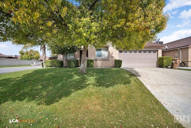 view of property hidden behind natural elements with a garage, stucco siding, concrete driveway, and a front yard