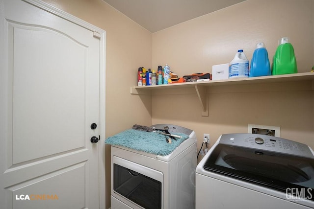 laundry area featuring laundry area and washer and clothes dryer