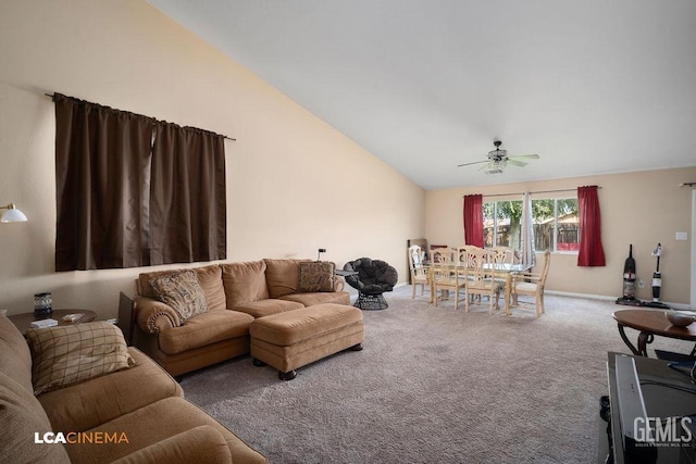 living area with carpet flooring, high vaulted ceiling, and ceiling fan