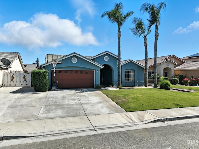 3023 Esperanza Dr, Bakersfield, CA 93313 - view of front facade with stucco siding, a front yard, an attached garage, driveway, and a tile roof