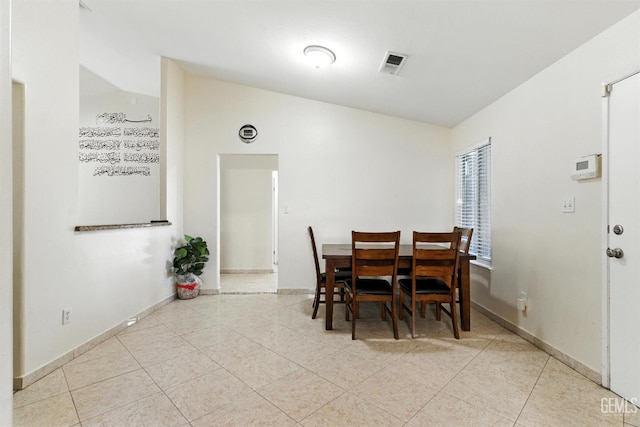 3023 Esperanza Dr, Bakersfield, CA 93313 - dining room with tile patterned flooring and lofted ceiling
