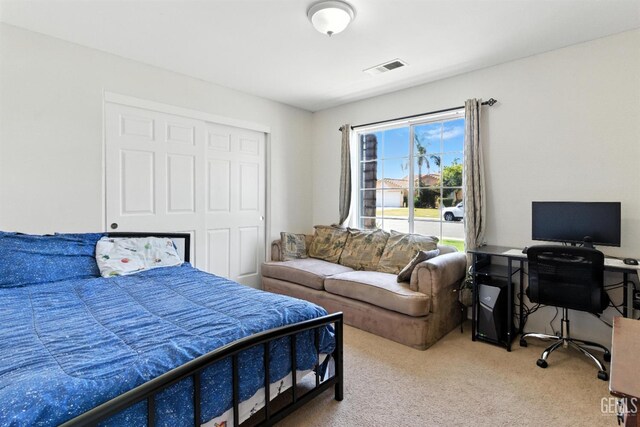 3023 Esperanza Dr, Bakersfield, CA 93313 - carpeted bedroom with a desk and a closet