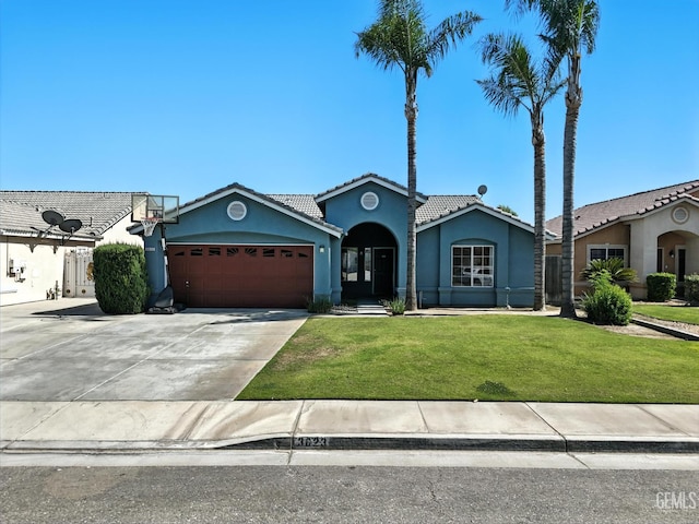 3023 Esperanza Dr, Bakersfield, CA 93313 - single story home featuring a tile roof, an attached garage, stucco siding, a front yard, and concrete driveway
