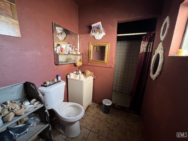 bathroom with tile patterned flooring, curtained shower, and toilet