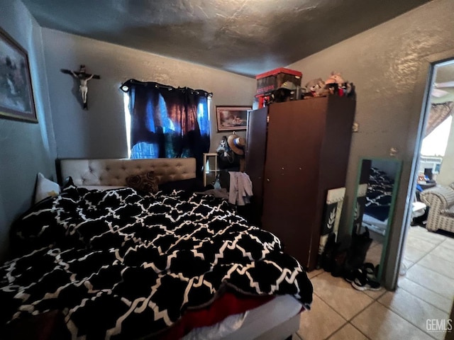 bedroom featuring light tile patterned floors