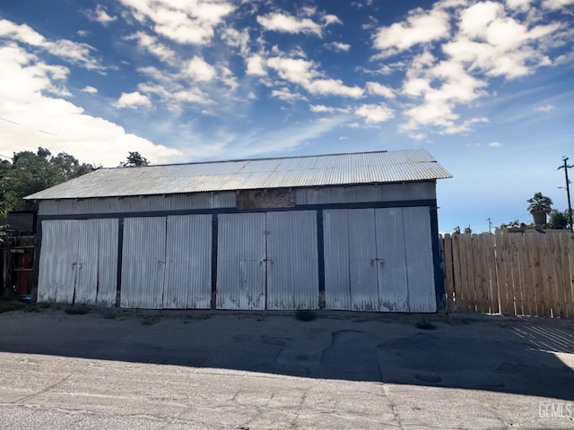 220 Tyler St, Taft, CA 93268 - view of outdoor structure featuring fence and an outbuilding