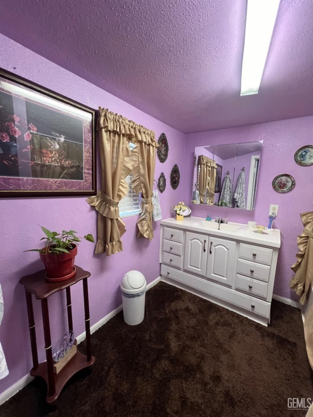 220 Tyler St, Taft, CA 93268 - full bathroom featuring a textured ceiling, vanity, and baseboards