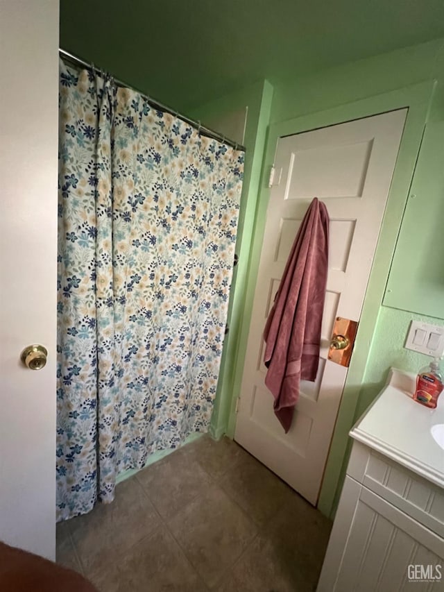 220 Tyler St, Taft, CA 93268 - bathroom with tile patterned floors, vanity, and a shower with shower curtain