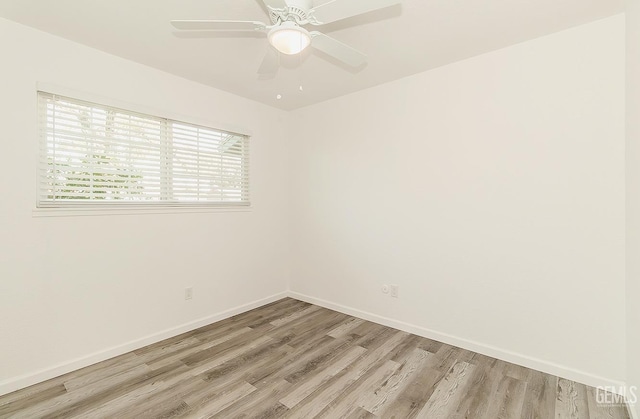 empty room with ceiling fan and light wood-type flooring