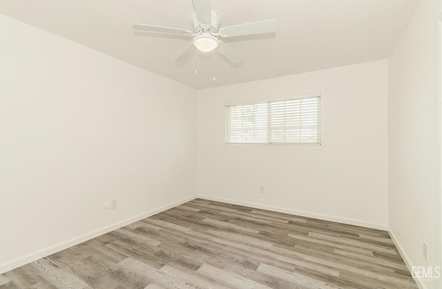 unfurnished room with ceiling fan and light wood-type flooring