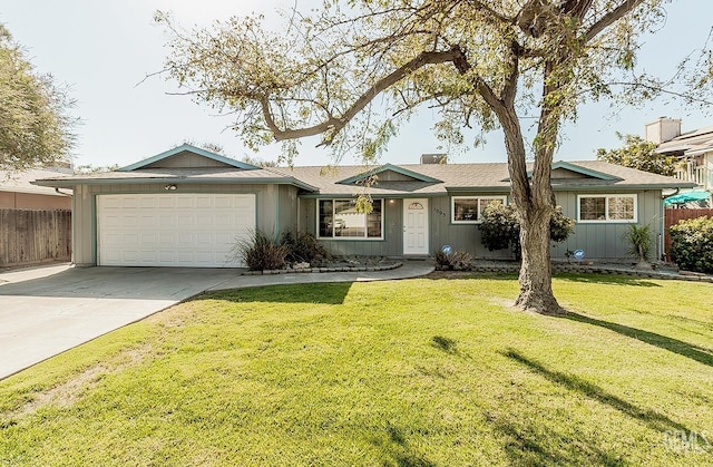 ranch-style house with a front yard and a garage