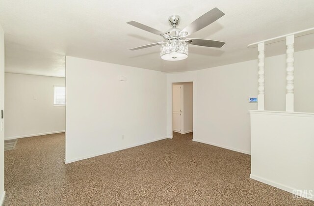 spare room featuring ceiling fan and carpet