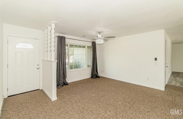 carpeted foyer entrance with ceiling fan