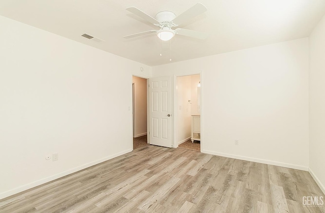 spare room with ceiling fan and light hardwood / wood-style flooring