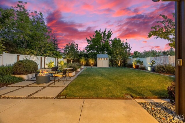 8113 Mcgraw Hill Dr, Bakersfield, CA 93311 - view of yard with a storage shed, an outbuilding, a fenced backyard, and a patio