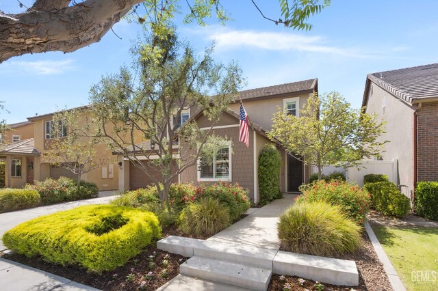 8113 Mcgraw Hill Dr, Bakersfield, CA 93311 - view of front of home with stucco siding and fence