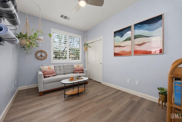 8113 Mcgraw Hill Dr, Bakersfield, CA 93311 - living area with baseboards, wood finished floors, visible vents, and ceiling fan