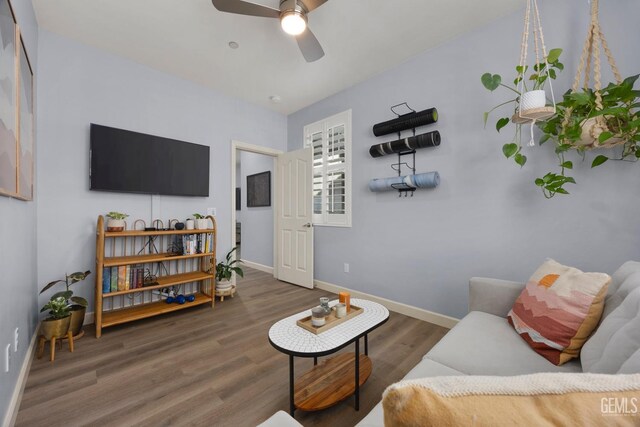 8113 Mcgraw Hill Dr, Bakersfield, CA 93311 - living area with wood finished floors, a ceiling fan, and baseboards
