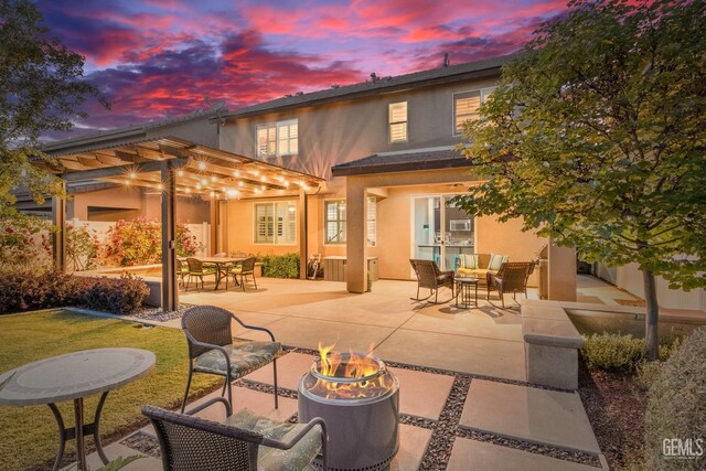 8113 Mcgraw Hill Dr, Bakersfield, CA 93311 - back of house featuring a patio area, a pergola, and stucco siding