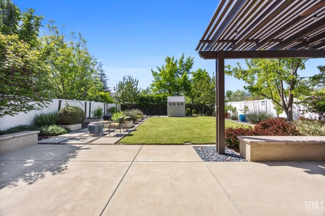 8113 Mcgraw Hill Dr, Bakersfield, CA 93311 - view of patio / terrace featuring a pergola, a storage unit, an outbuilding, and a fenced backyard