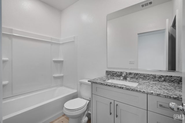 full bathroom featuring vanity, shower / bathing tub combination, wood-type flooring, and toilet