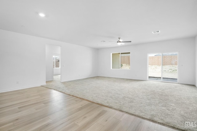 unfurnished room with light hardwood / wood-style flooring and ceiling fan