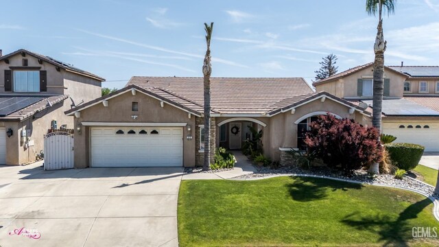 22 Emerald Isle Way, Bakersfield, CA 93314 - view of front facade featuring a gate, concrete driveway, a front lawn, an attached garage, and stucco siding