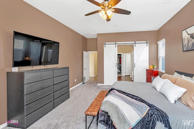22 Emerald Isle Way, Bakersfield, CA 93314 - bedroom with baseboards, carpet, ceiling fan, and a barn door