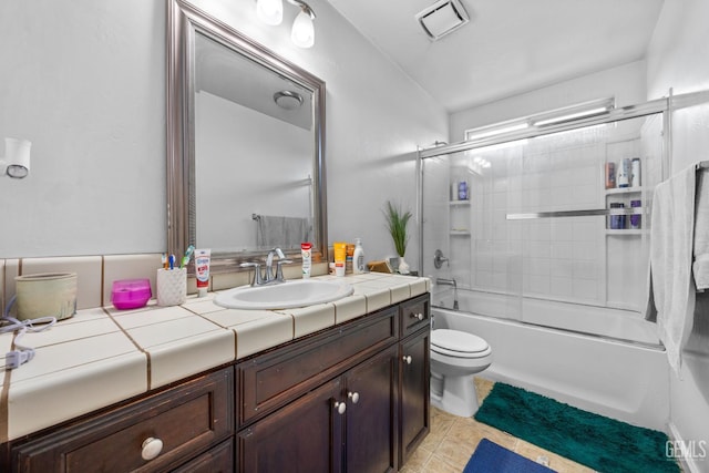 9301 Cobble Mountain Rd, Bakersfield, CA 93313 - bathroom featuring vanity, toilet, combined bath / shower with glass door, and tile patterned floors
