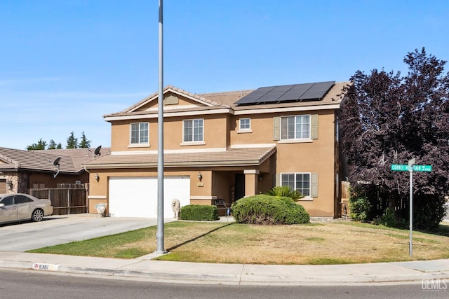9301 Cobble Mountain Rd, Bakersfield, CA 93313 - view of front of house featuring a garage, stucco siding, roof mounted solar panels, driveway, and a tiled roof