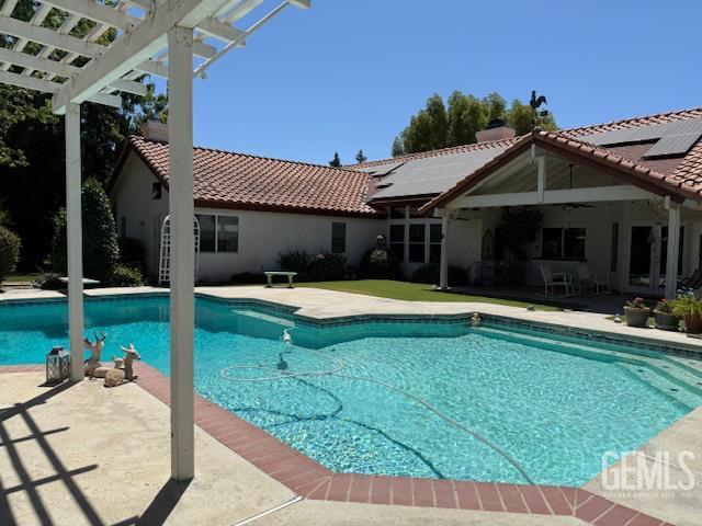 2012 Calle Las Brisas, Bakersfield, CA 93309 - outdoor pool featuring a pergola, a patio, and a ceiling fan