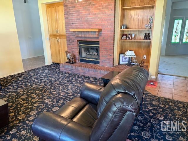 2012 Calle Las Brisas, Bakersfield, CA 93309 - carpeted living area with a fireplace and built in shelves