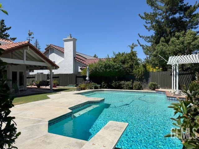 2012 Calle Las Brisas, Bakersfield, CA 93309 - view of pool with a fenced backyard, a patio, a diving board, and french doors