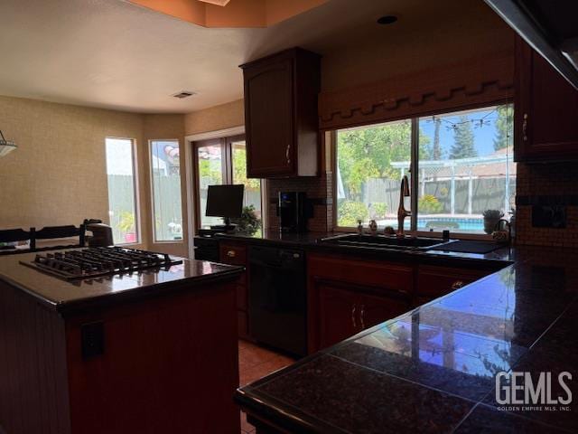 2012 Calle Las Brisas, Bakersfield, CA 93309 - kitchen featuring dishwasher, gas cooktop, plenty of natural light, and tile countertops