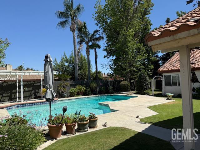 2012 Calle Las Brisas, Bakersfield, CA 93309 - view of swimming pool featuring a fenced backyard and a patio