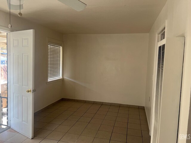 1026 Flower St, Bakersfield, CA 93305 - empty room with a heating unit and light tile patterned floors