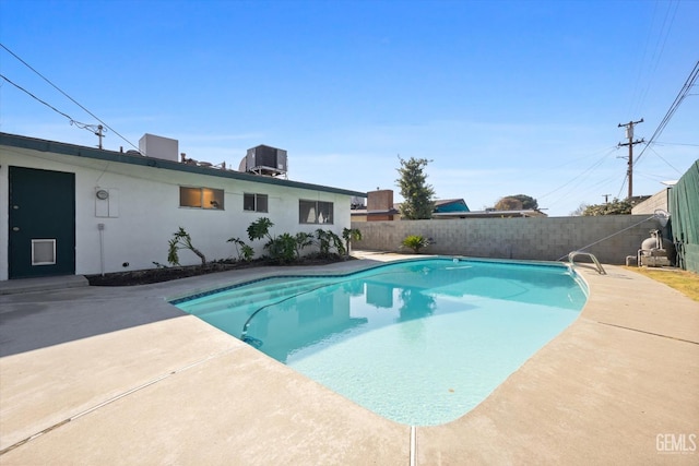 view of pool featuring central AC and a patio