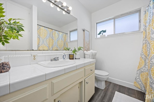 bathroom with vanity, hardwood / wood-style floors, and toilet